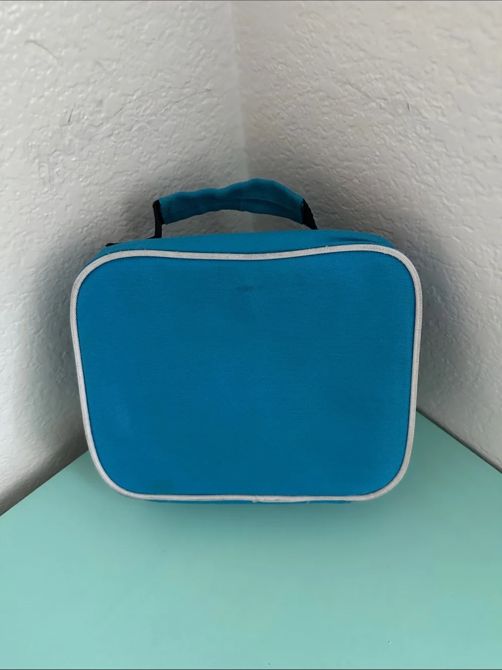 Walmart blue insulated lunch box with a minimalist white ’LUNCH’ graphic-used